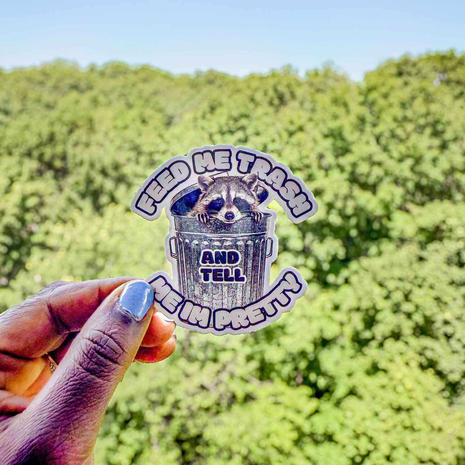 Trash panda sticker that reads "Feed me trash and tell me I'm pretty"