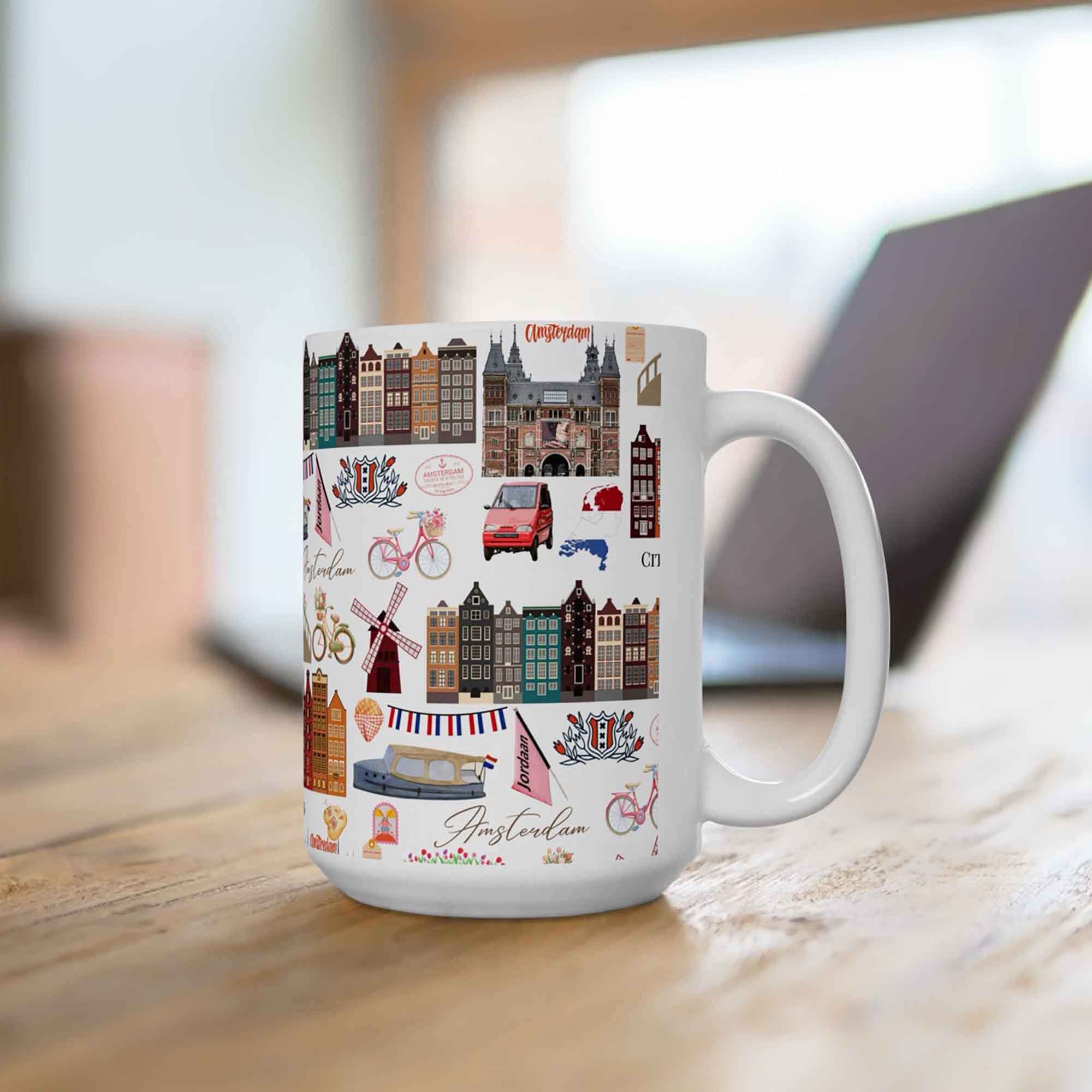 Amsterdam 15oz travel mug with canal landmark pattern in a lifestyle mockup photo on a desk